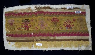 Fragmento de paño con flecos